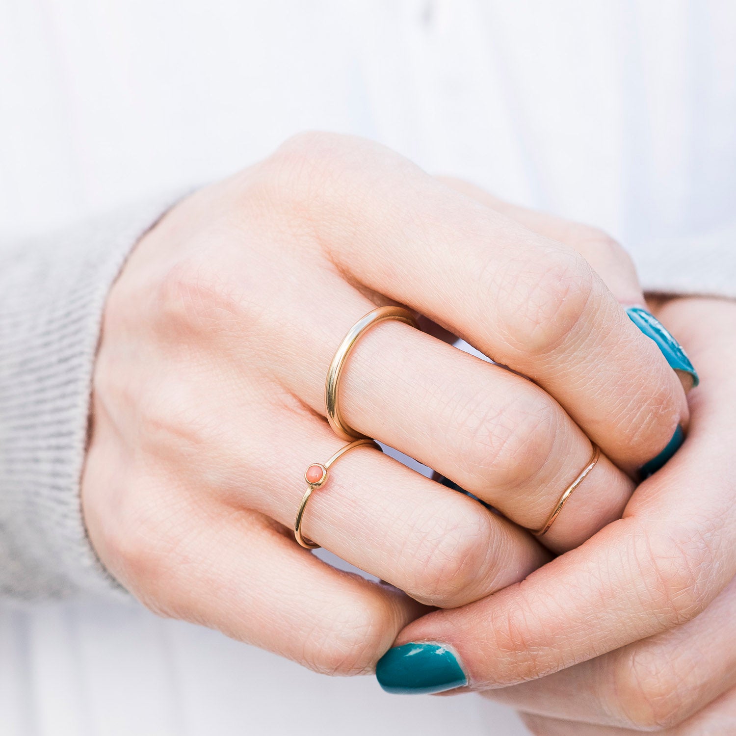2mm halo band in 9ct yellow gold being worn, close up