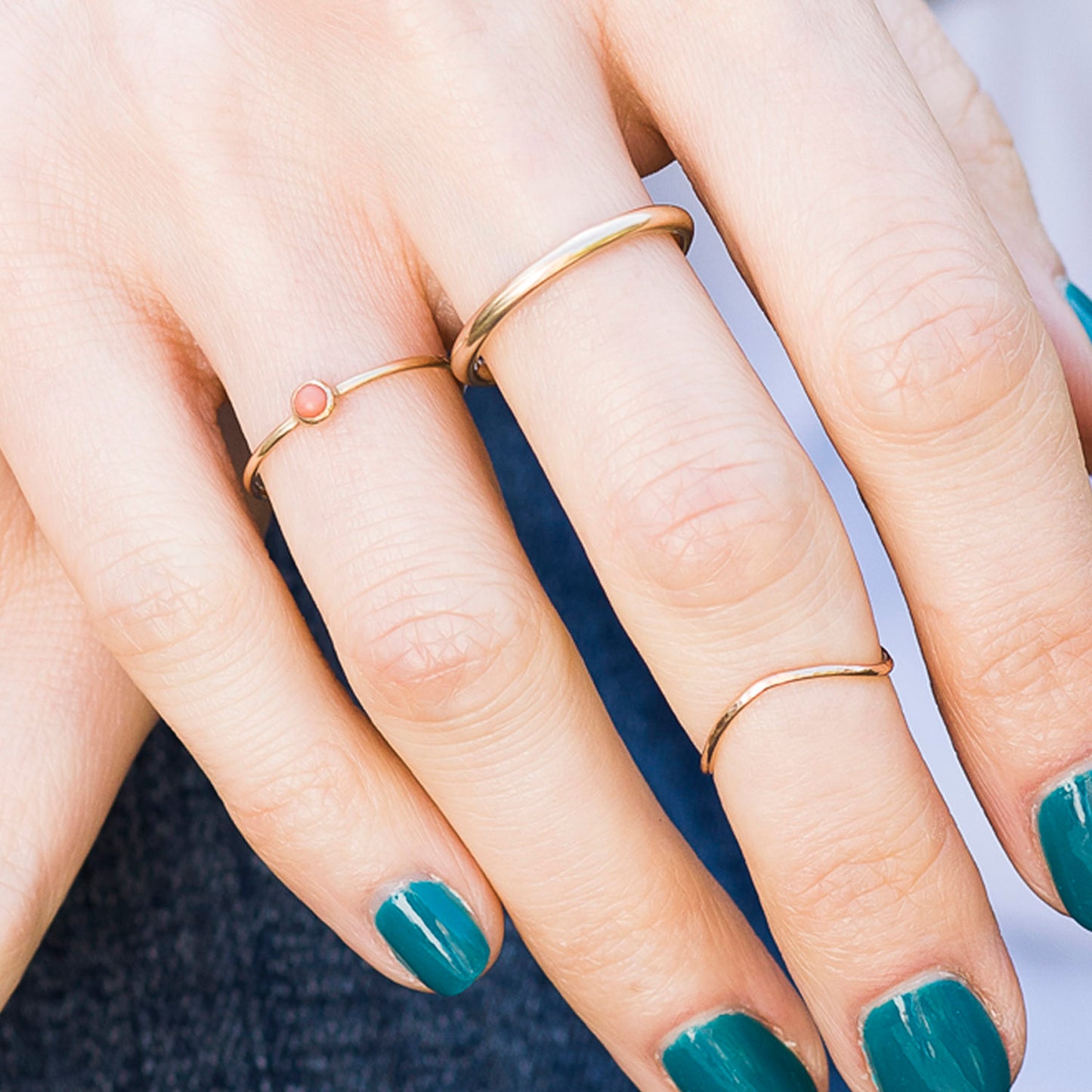 2mm halo band in 9ct yellow gold, being worn, close up