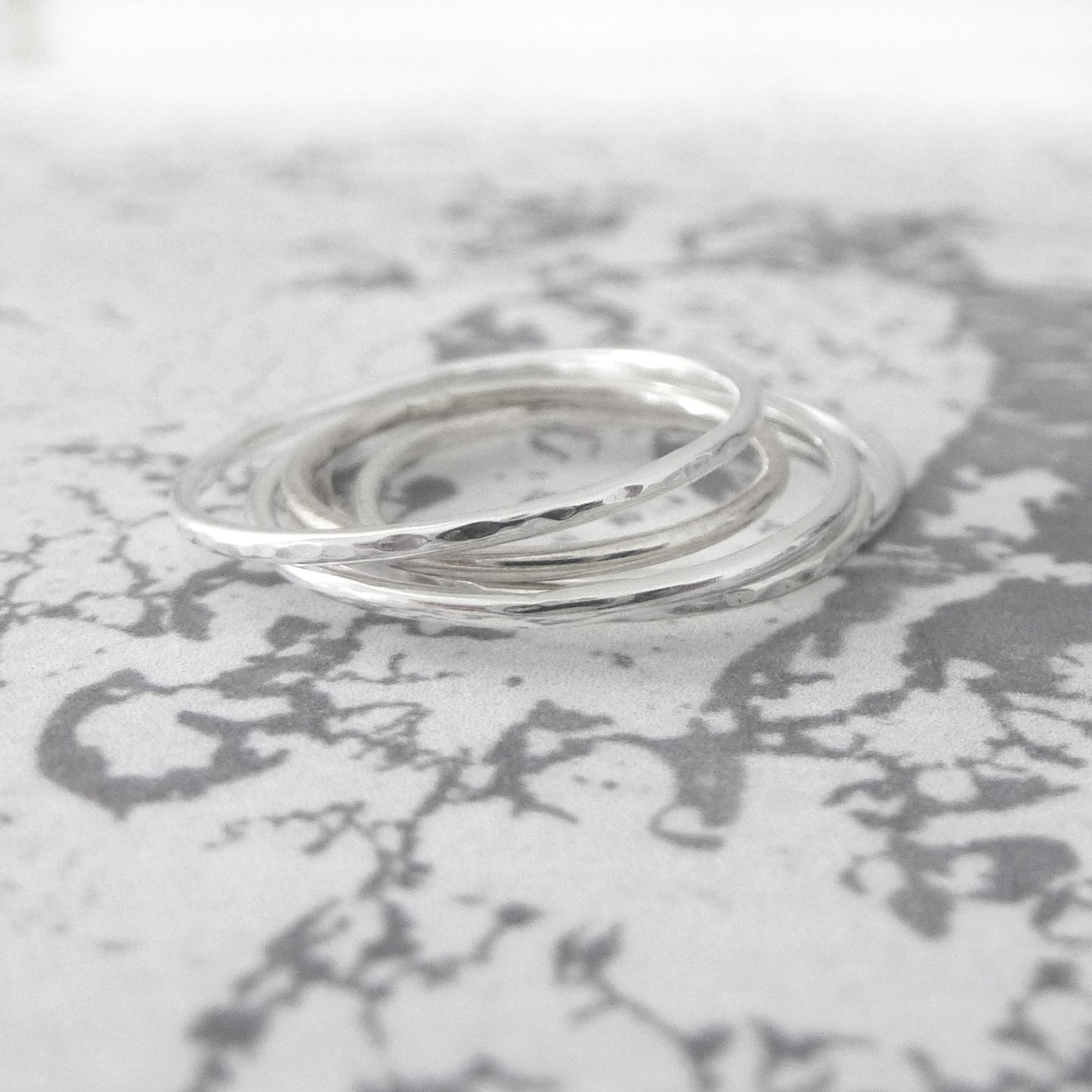 A stack of skinny silver rings