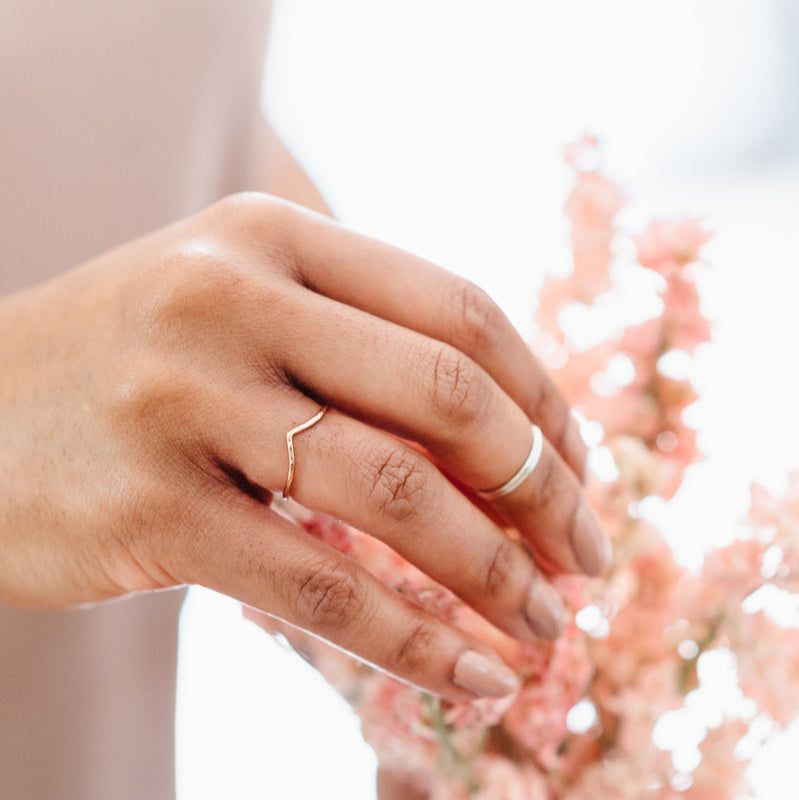 slim wishbone wedding band, being worn