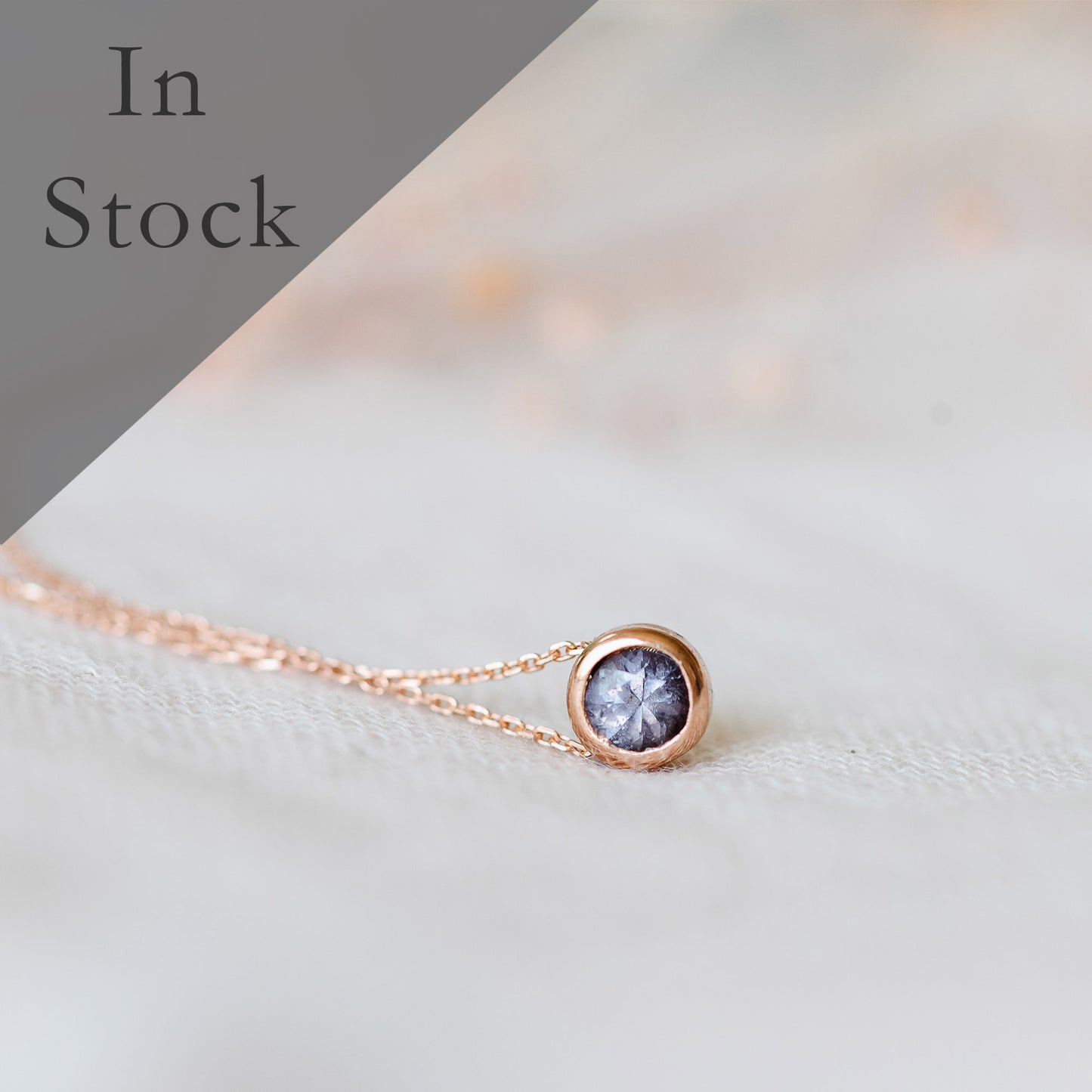 Purple spinel solitaire necklace in 9ct rose gold