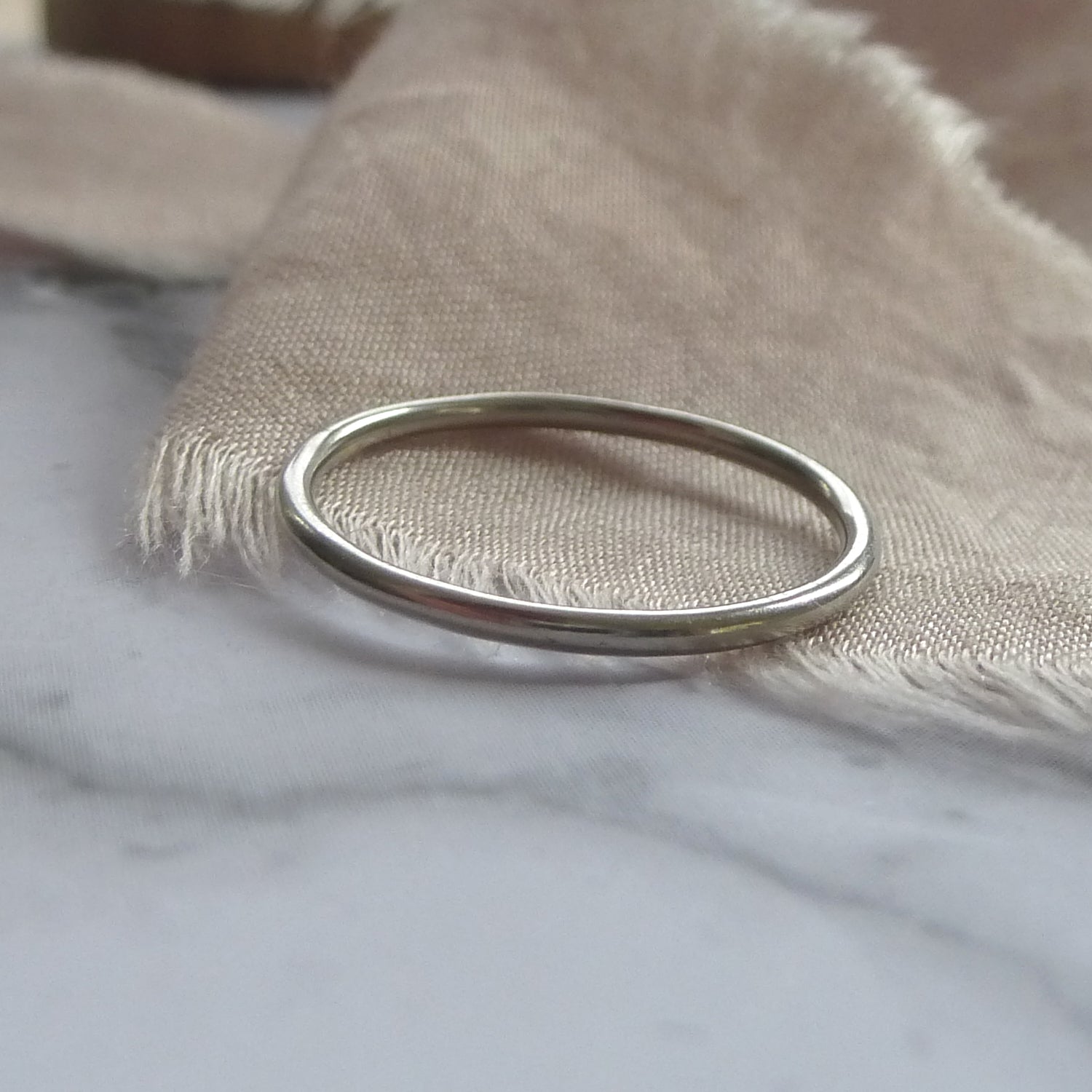 1.2mm band in 18ct white gold, smooth finish