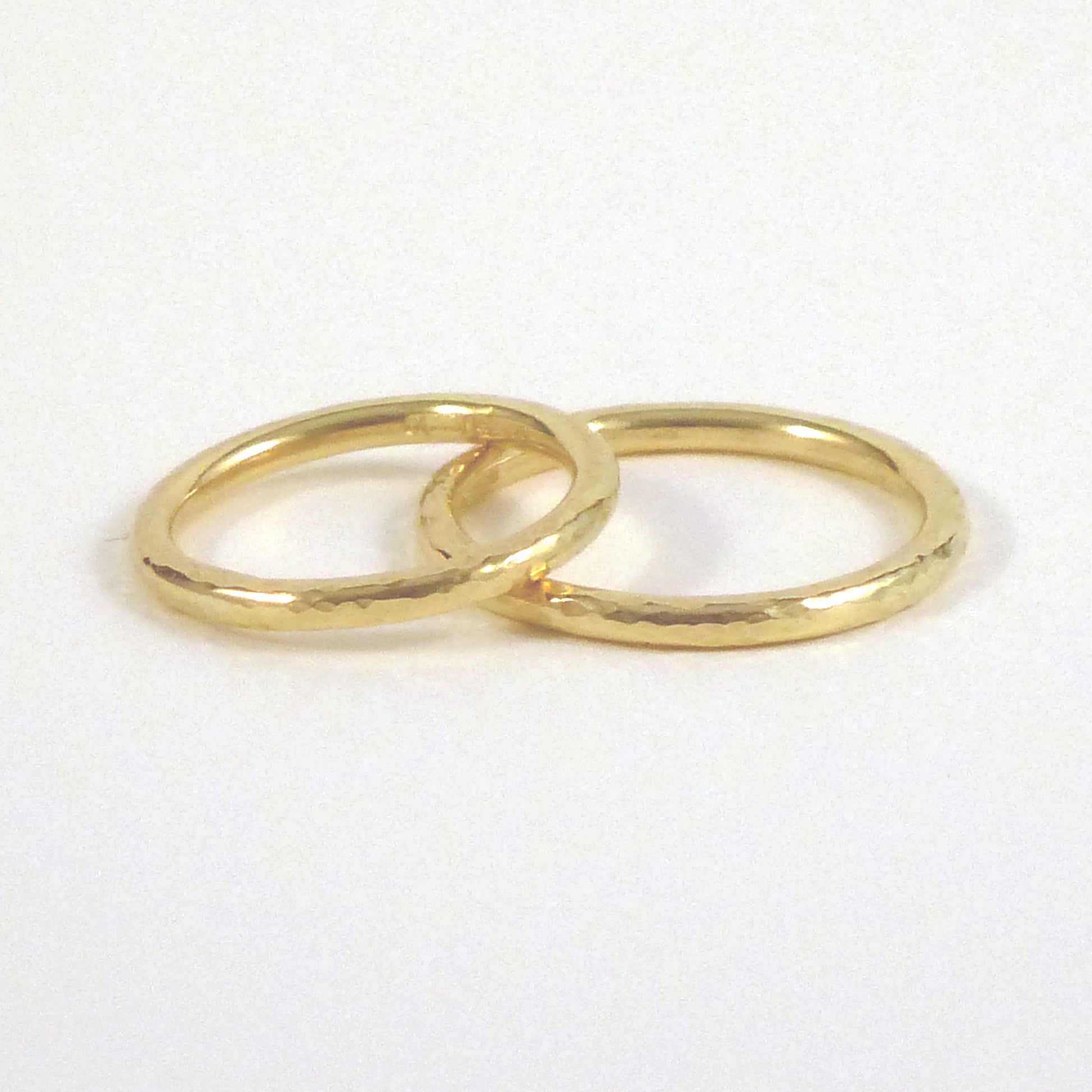 2mm halo bands in 18ct yellow gold, hammered finish, image on white background