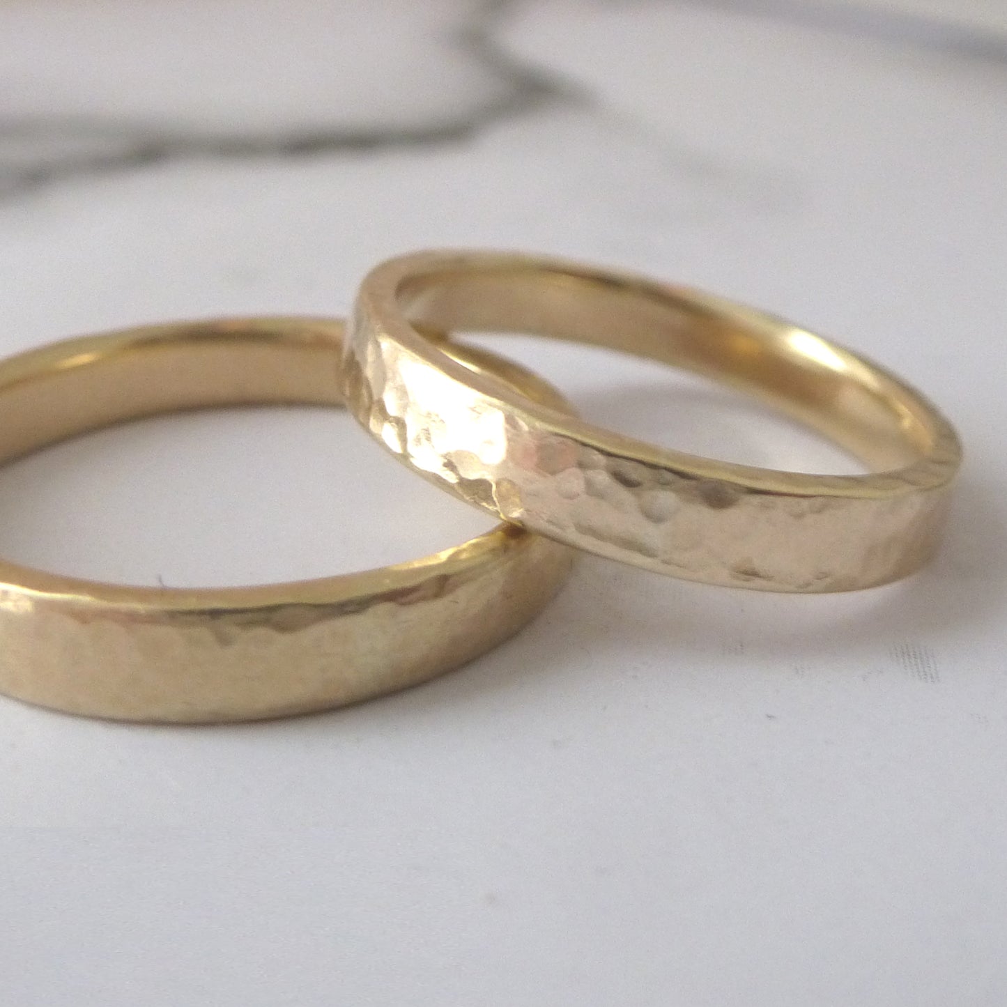 Two stacked bands in recycled 9ct yellow gold, one hammered finish, 3mm with square edges, one 4mm with soft edges