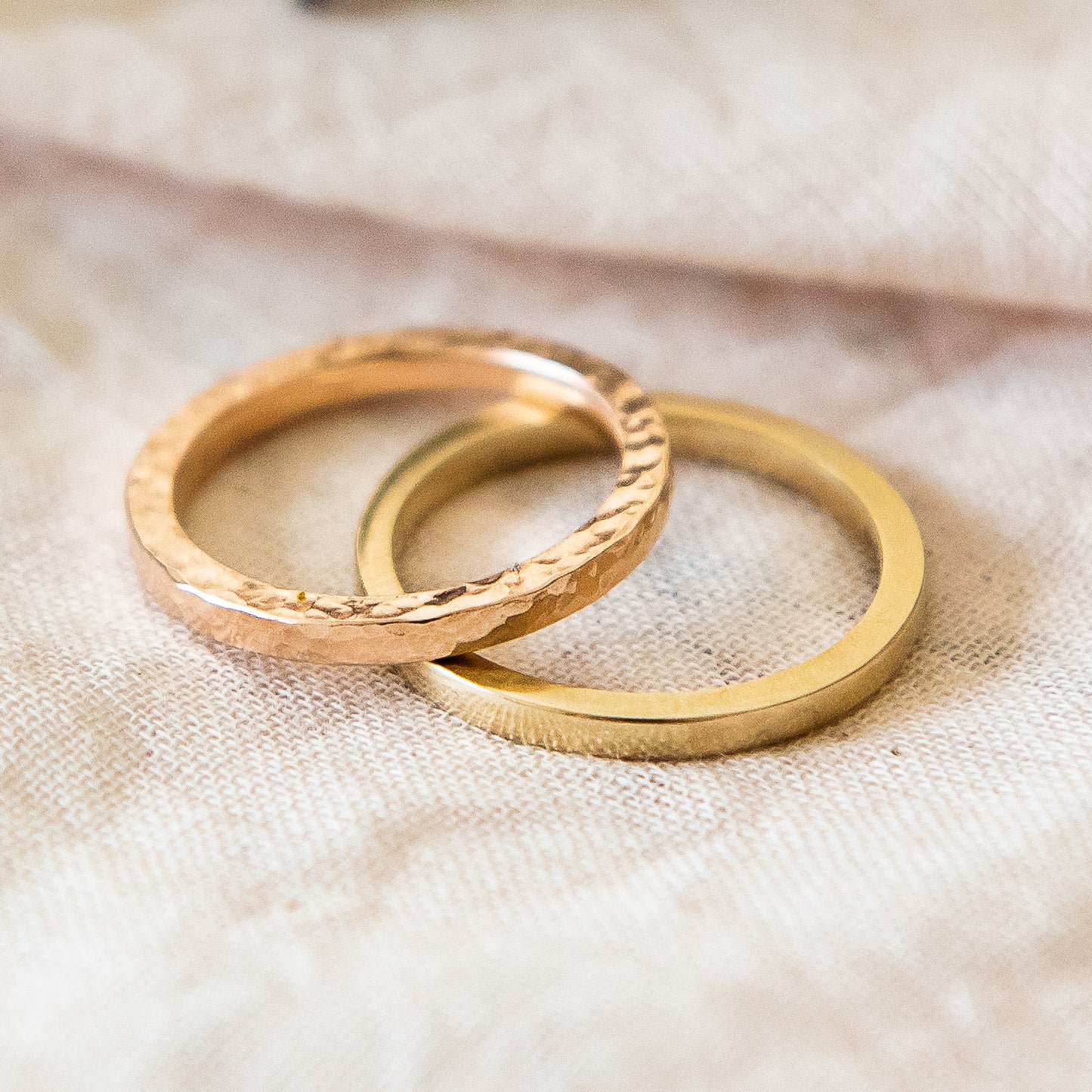 Close up of two rings, square profile, 9ct recycled gold