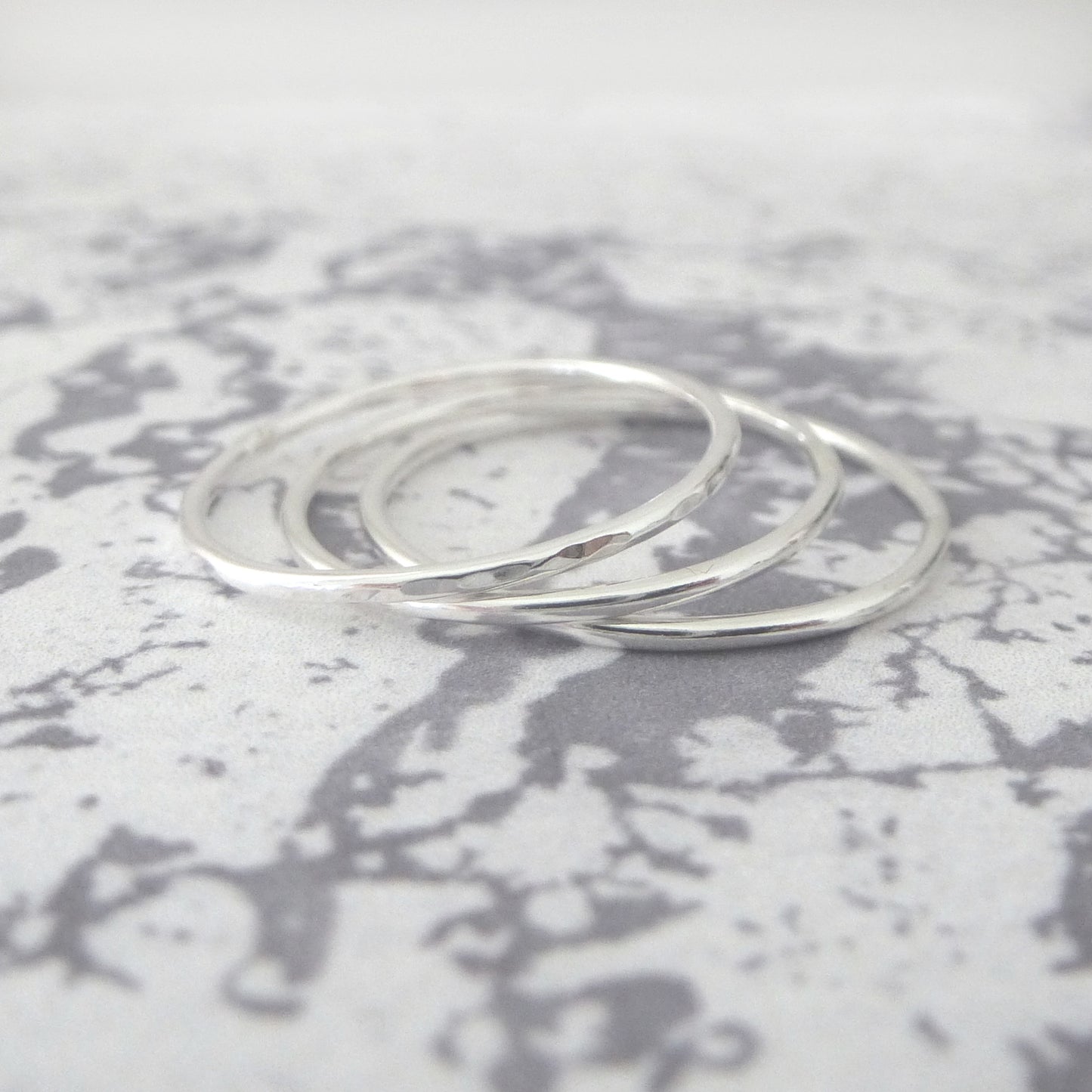 thin bands in sterling silver, hammered and smooth finishes