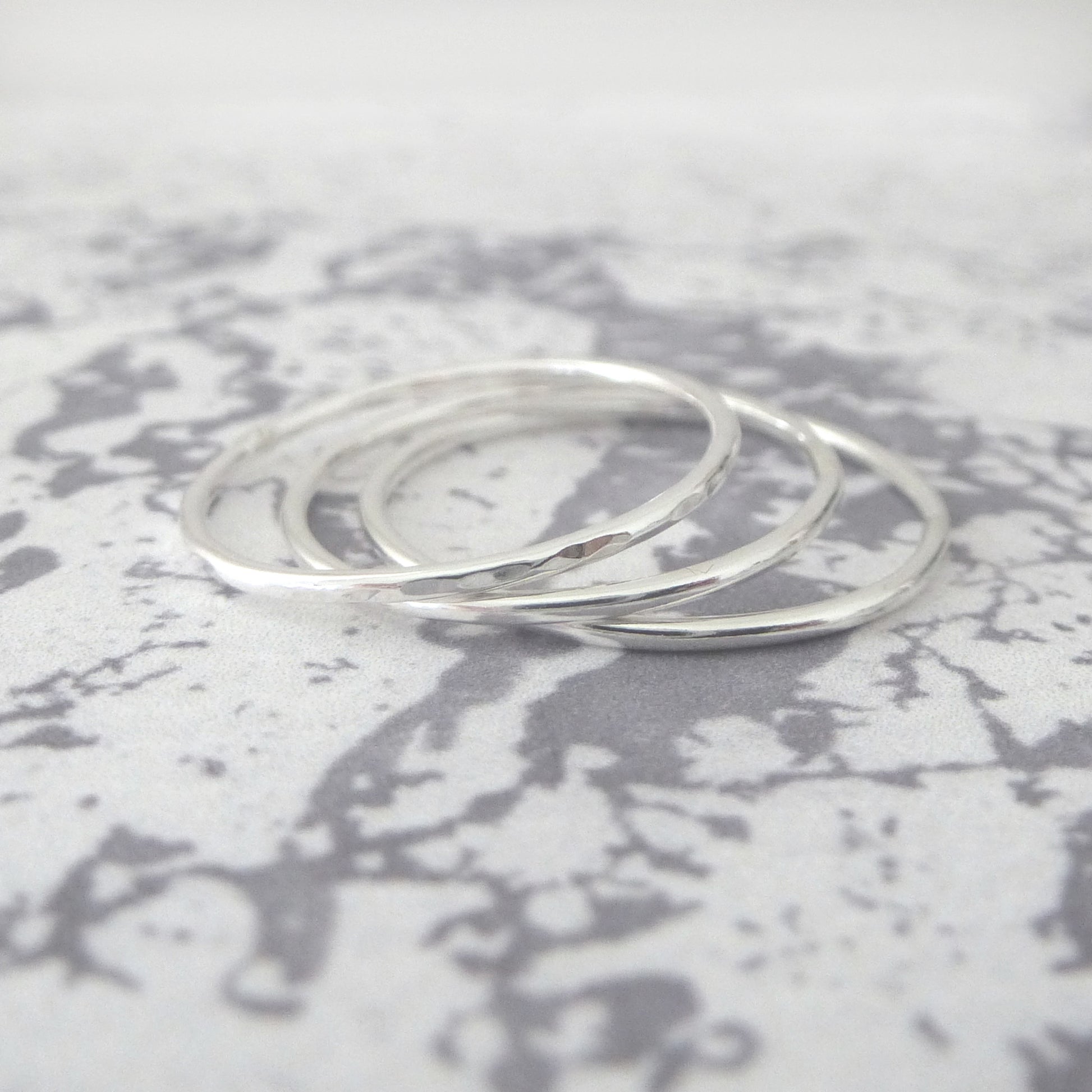 thin bands in sterling silver, hammered and smooth finishes